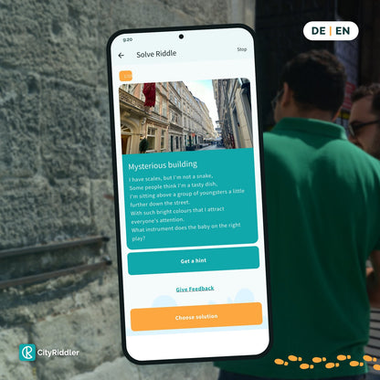 The CityRiddler app showing a riddle, available in German and English